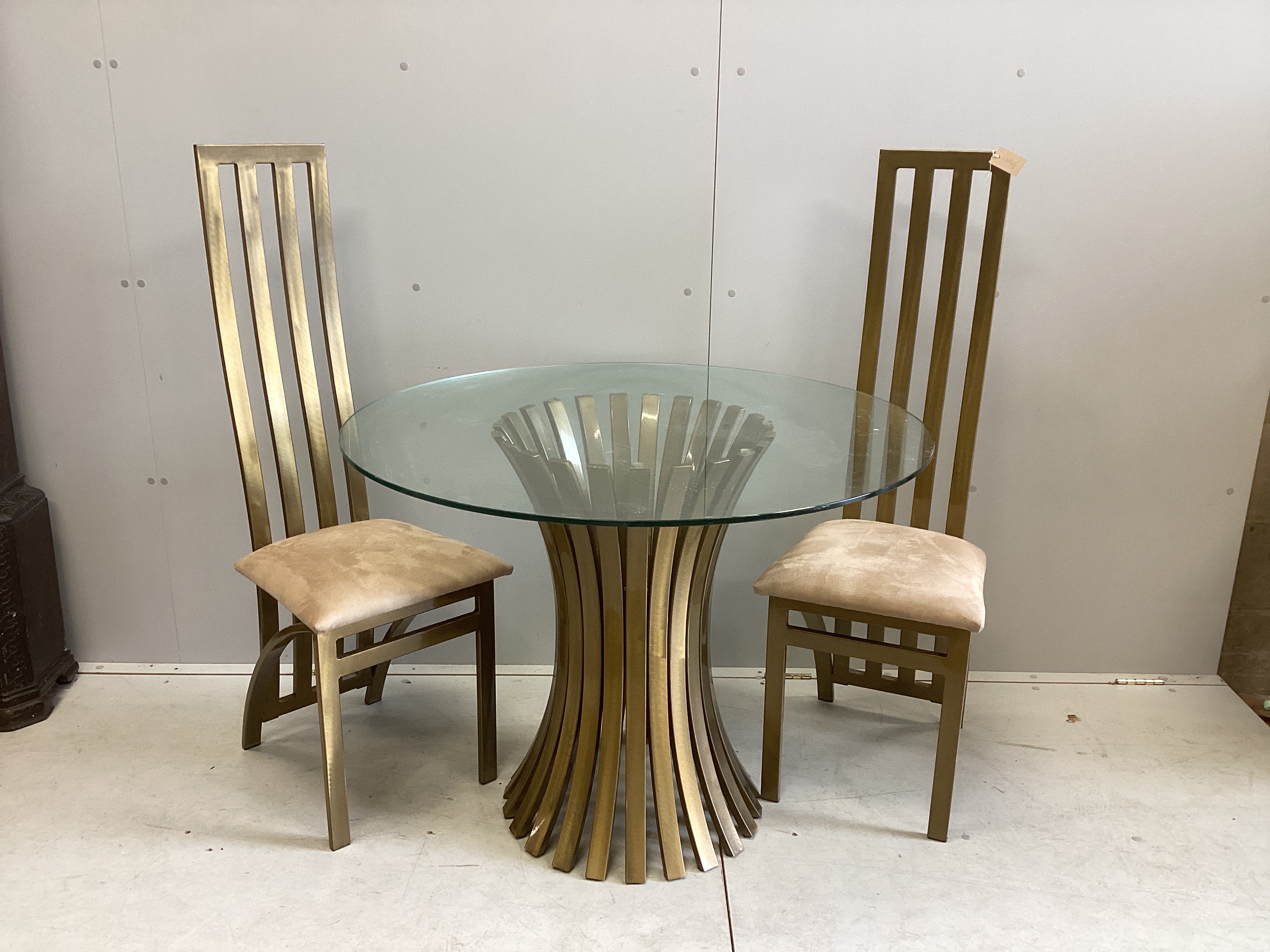 A Contemporary Italian design circular gilt metal glass top table, diameter 100cm, height 74cm, and two chairs